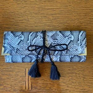 White House slim snake jewelry roll